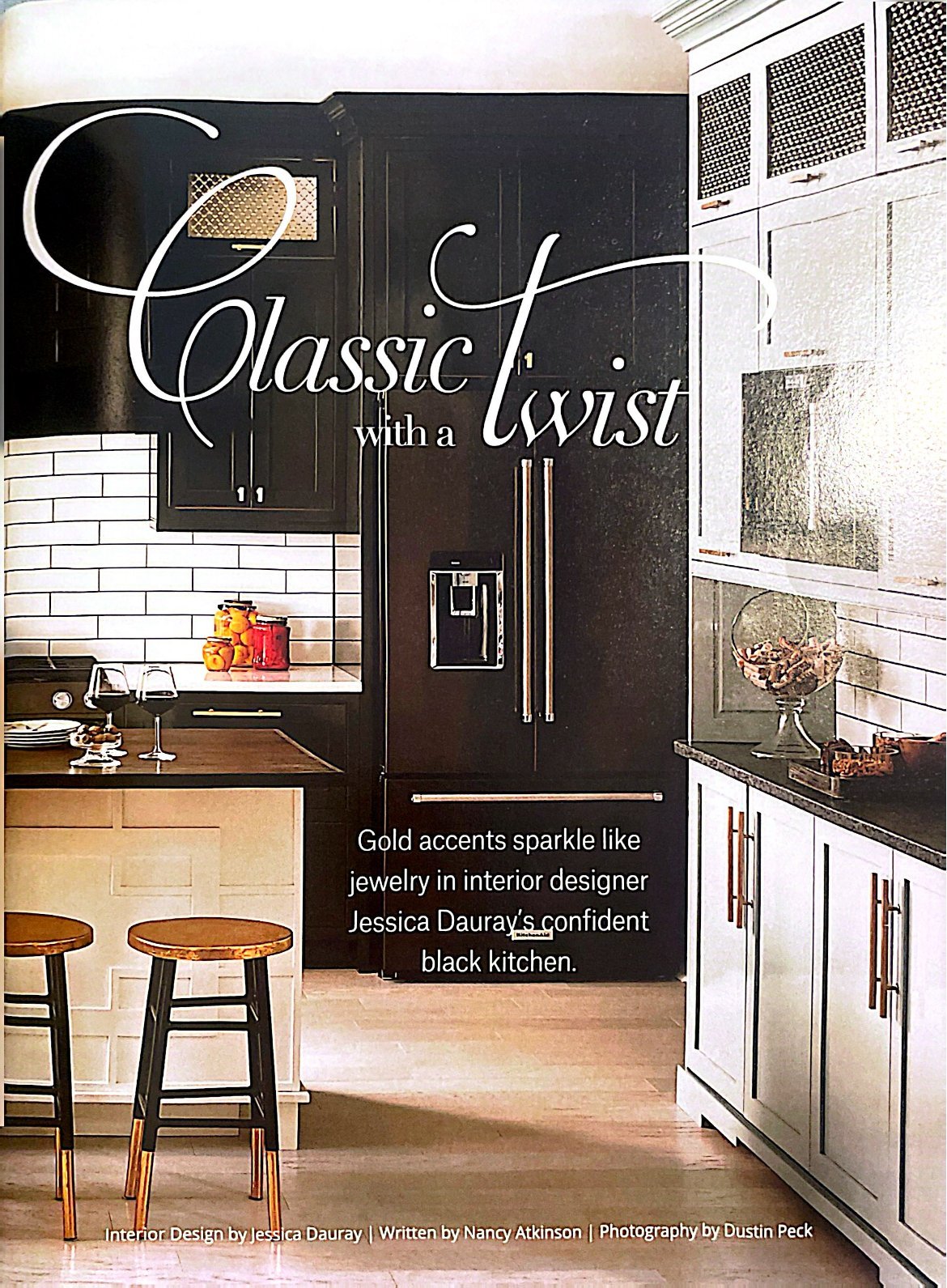 Classic with a Twist opening page with black cabinetry, a white island and gold-dipped stools
